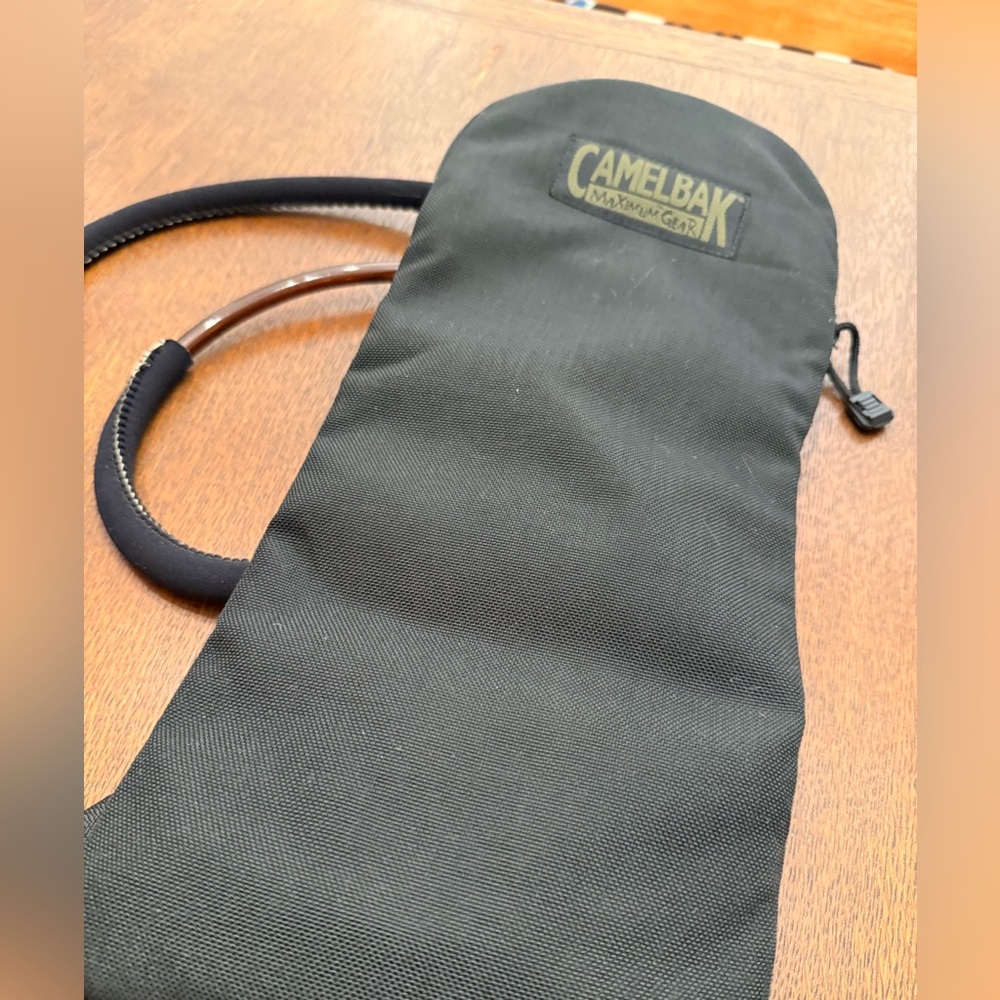 DADS ESTATE SALE: Never used Camelbak with bladder, about 17” x 7”. - Picture 2 of 5